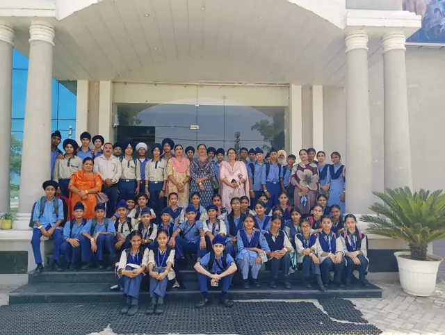 Pupils and teachers gathered at the school entrance